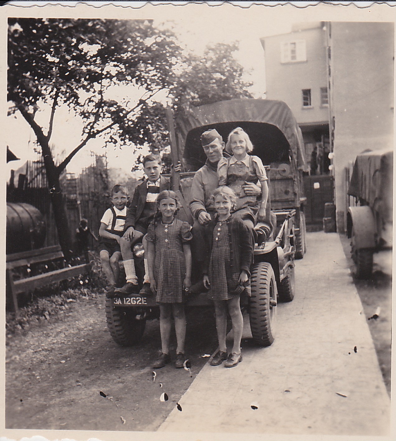 Capt McClellan and kids in Winnweiler Germany 5-9-45